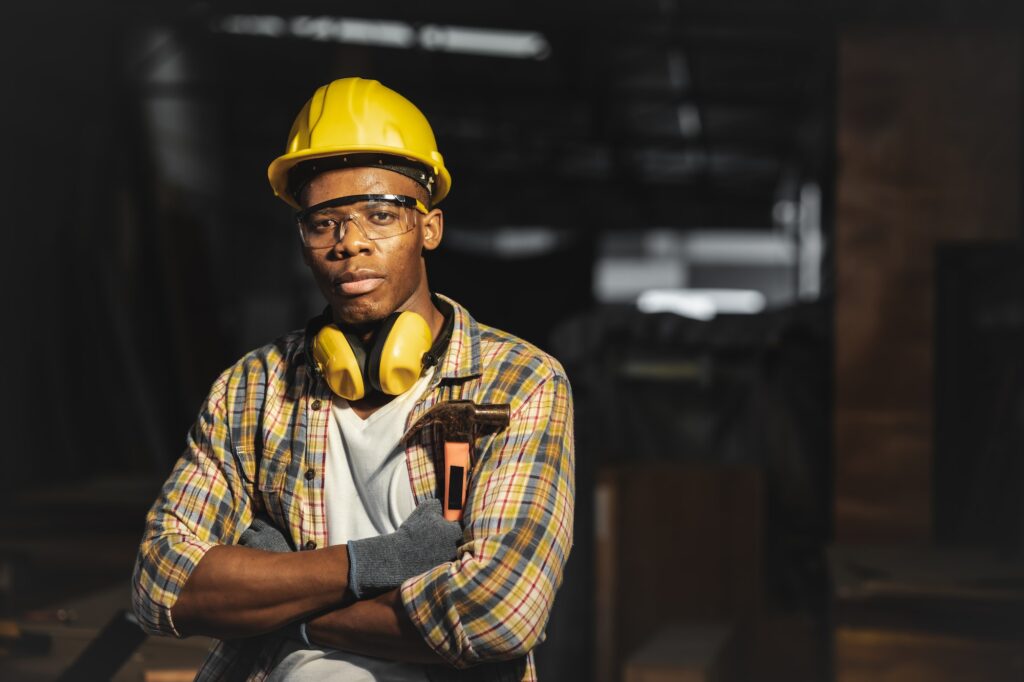 black worker male young confident smart arm crossed for builder handy man professional work